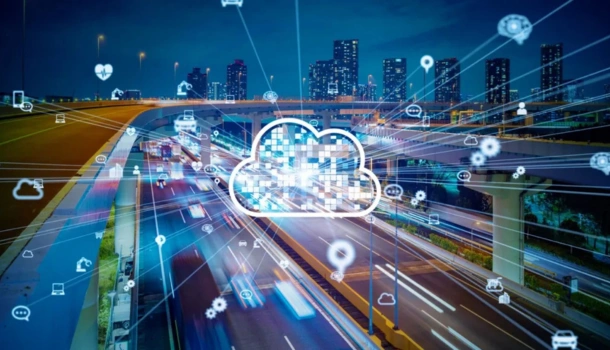 Digital cloud icon over a busy city highway at night