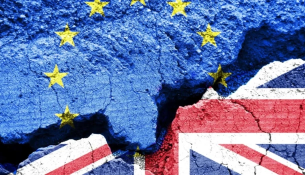 Cracked surface painted with the European Union flag on the left and the United Kingdom flag on the right