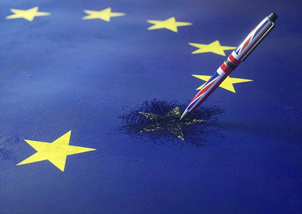eu flag with uk pen scratching out a star