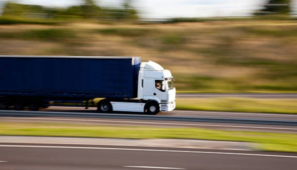 transport truck driving on the highway