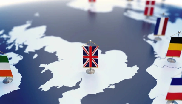 A map of Europe with miniature national flags, including a prominent Union Jack over the UK